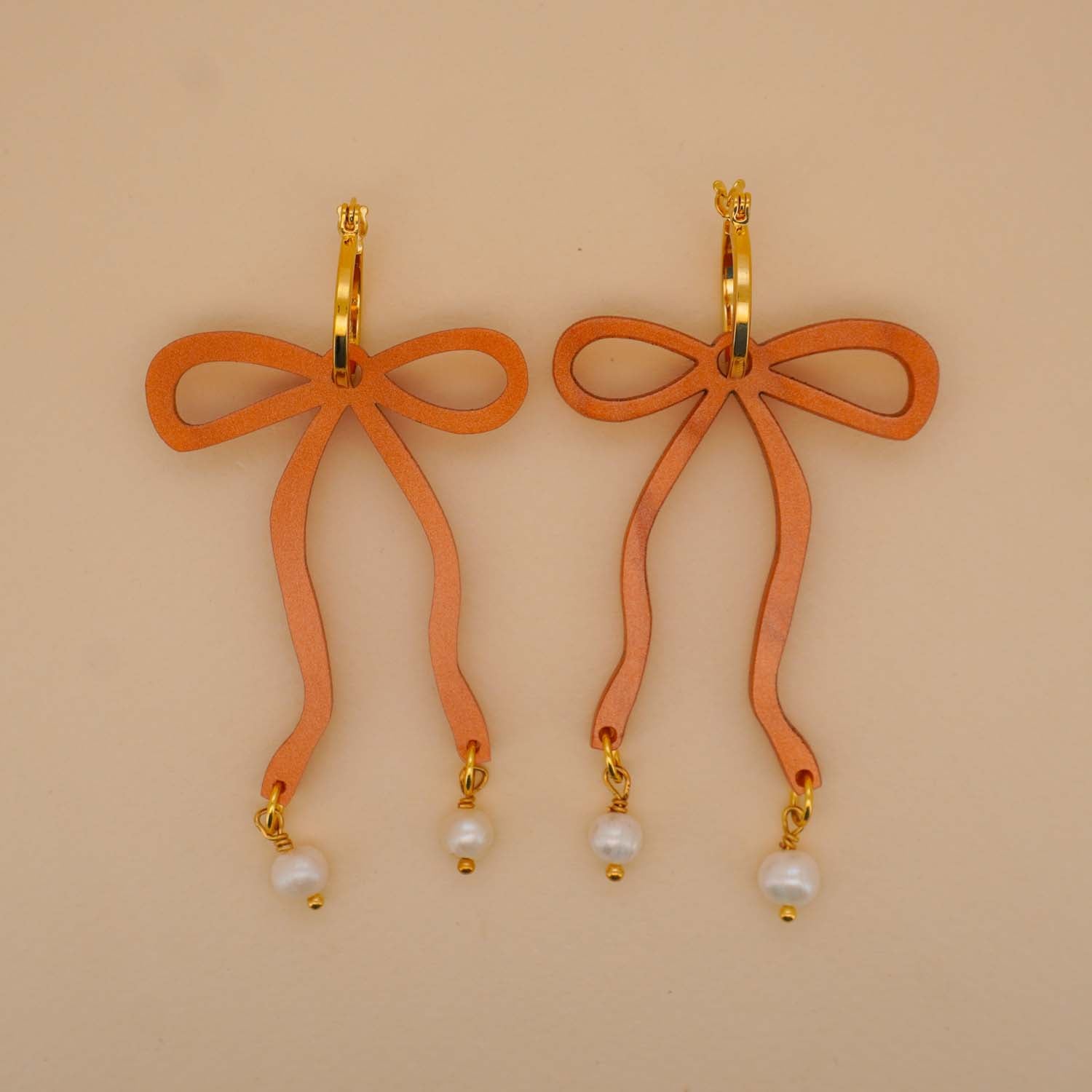 Bow Hoop Earrings in Copper