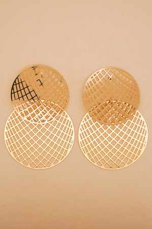 Pair of round earrings with woven top and mesh bottom on a beige background